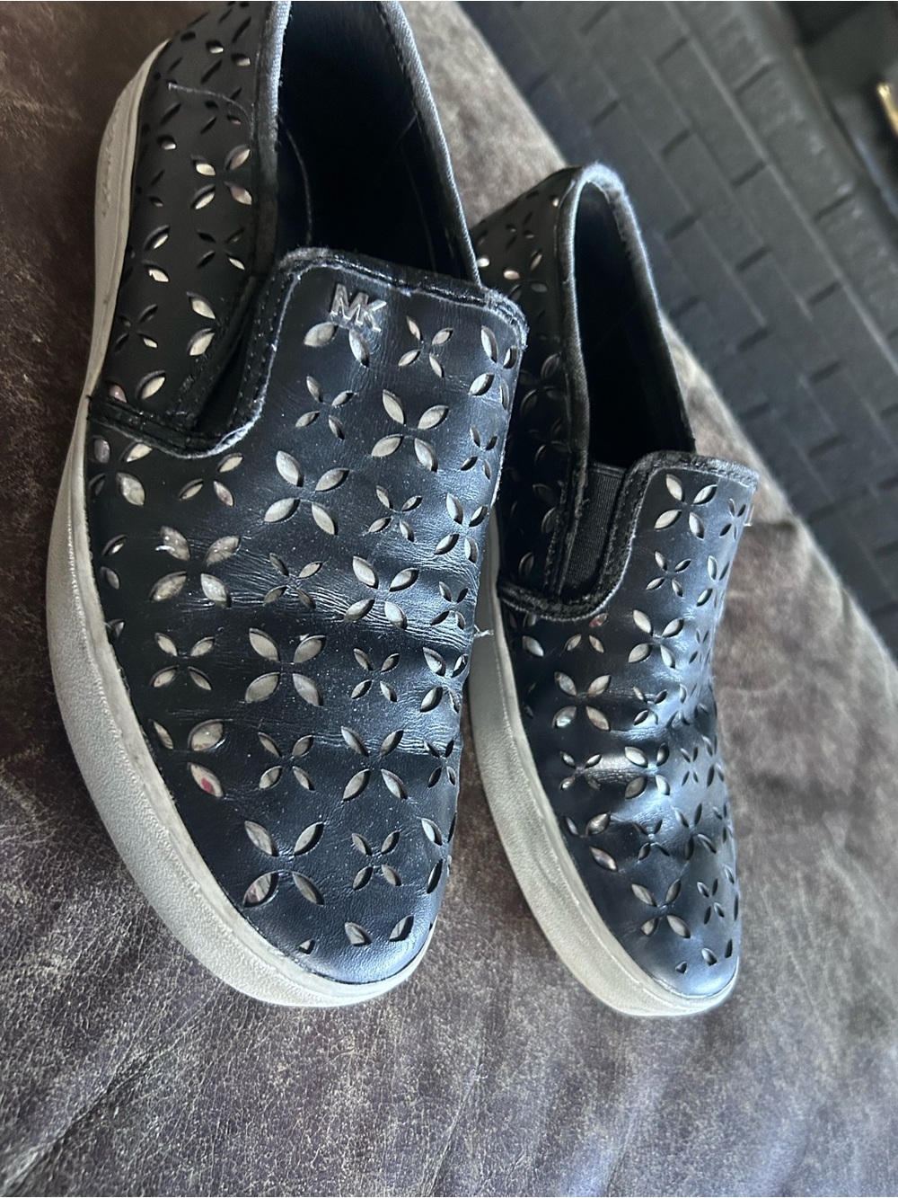 MICHAEL KORS Black Perforated Slip-On Sneakers with White Soles